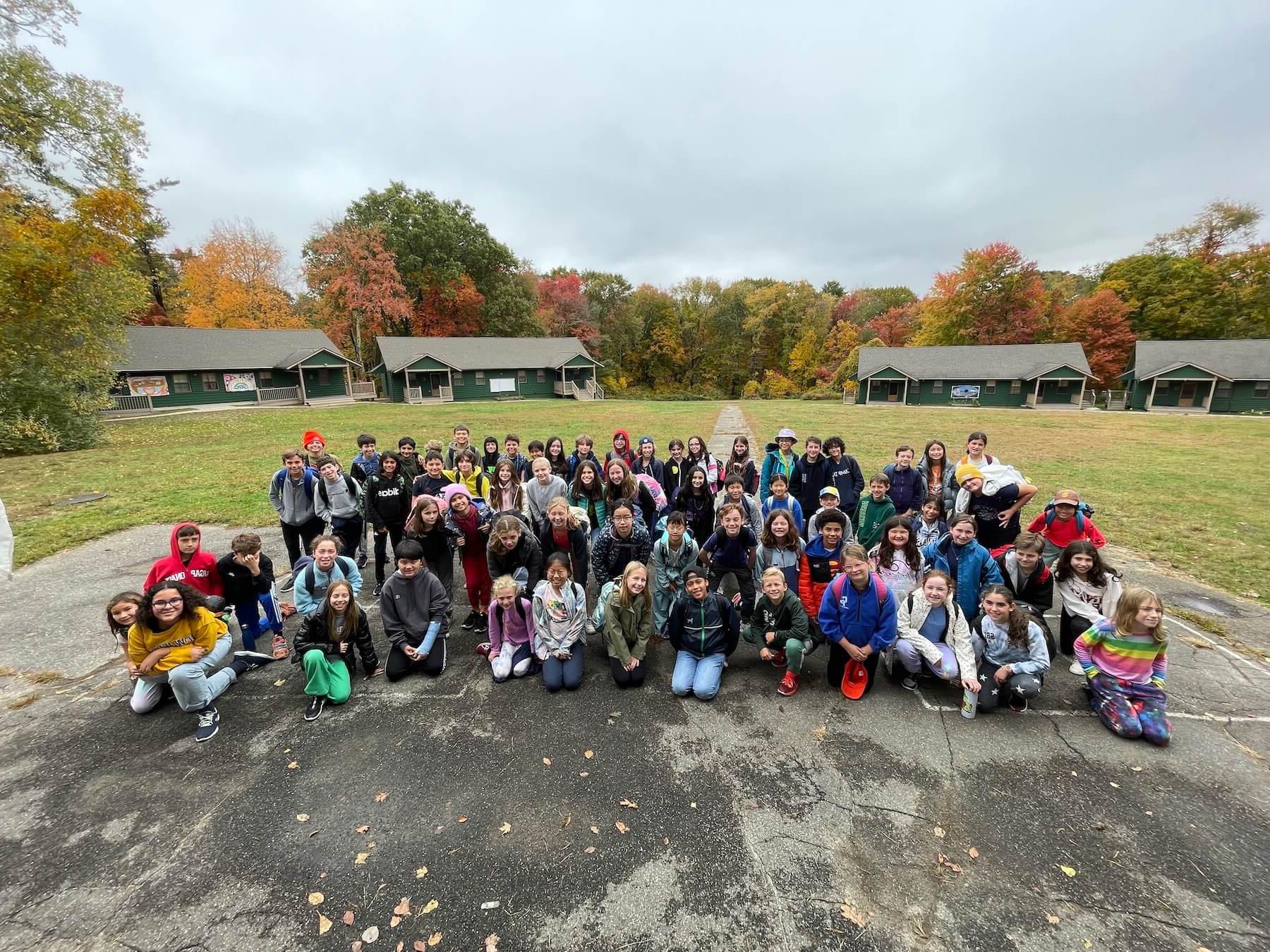 Ethical Culture's 5th Grade poses for group picture outside at Nature's Classroom