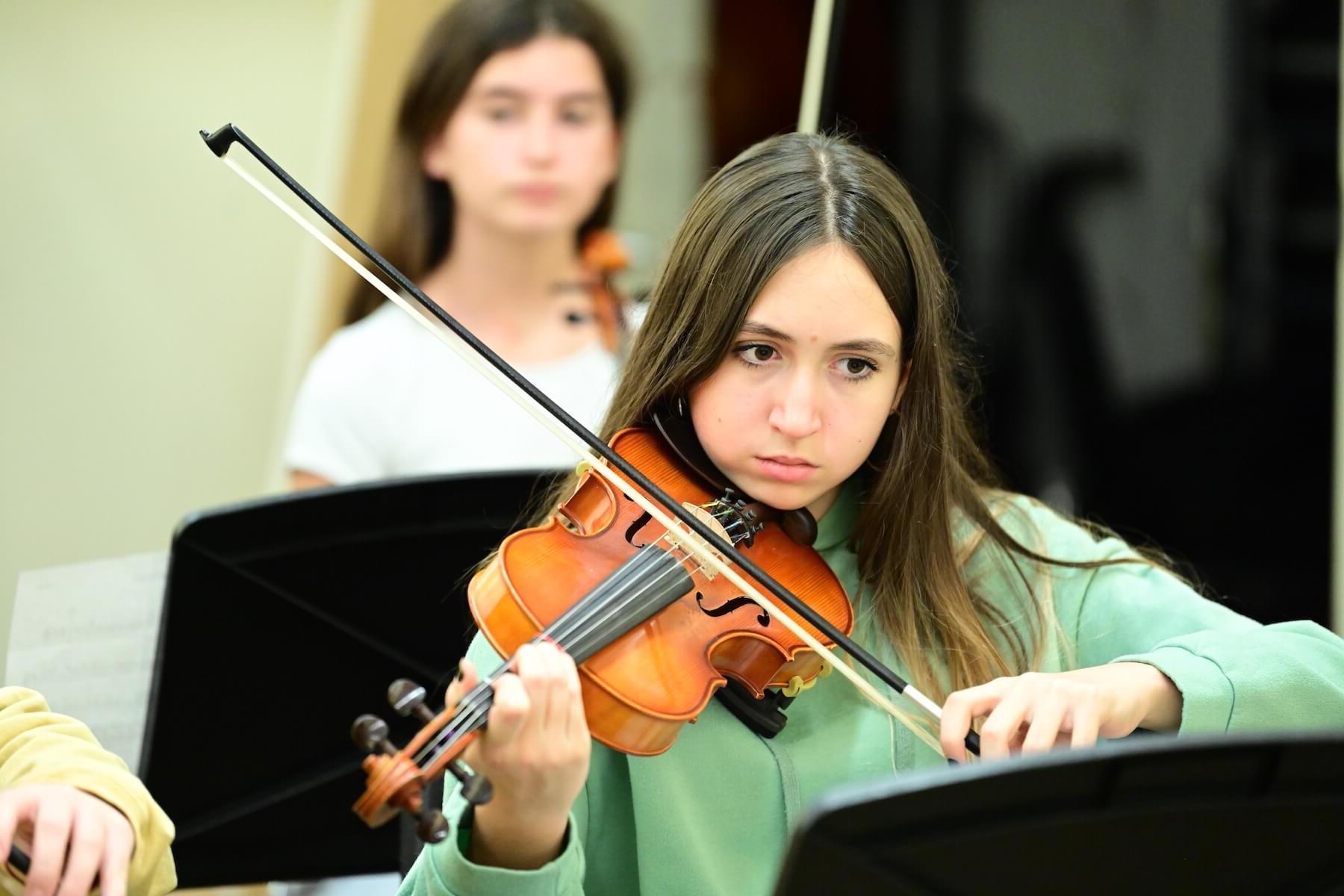 Ethical Culture Fieldston School Fieldston student practicing violin