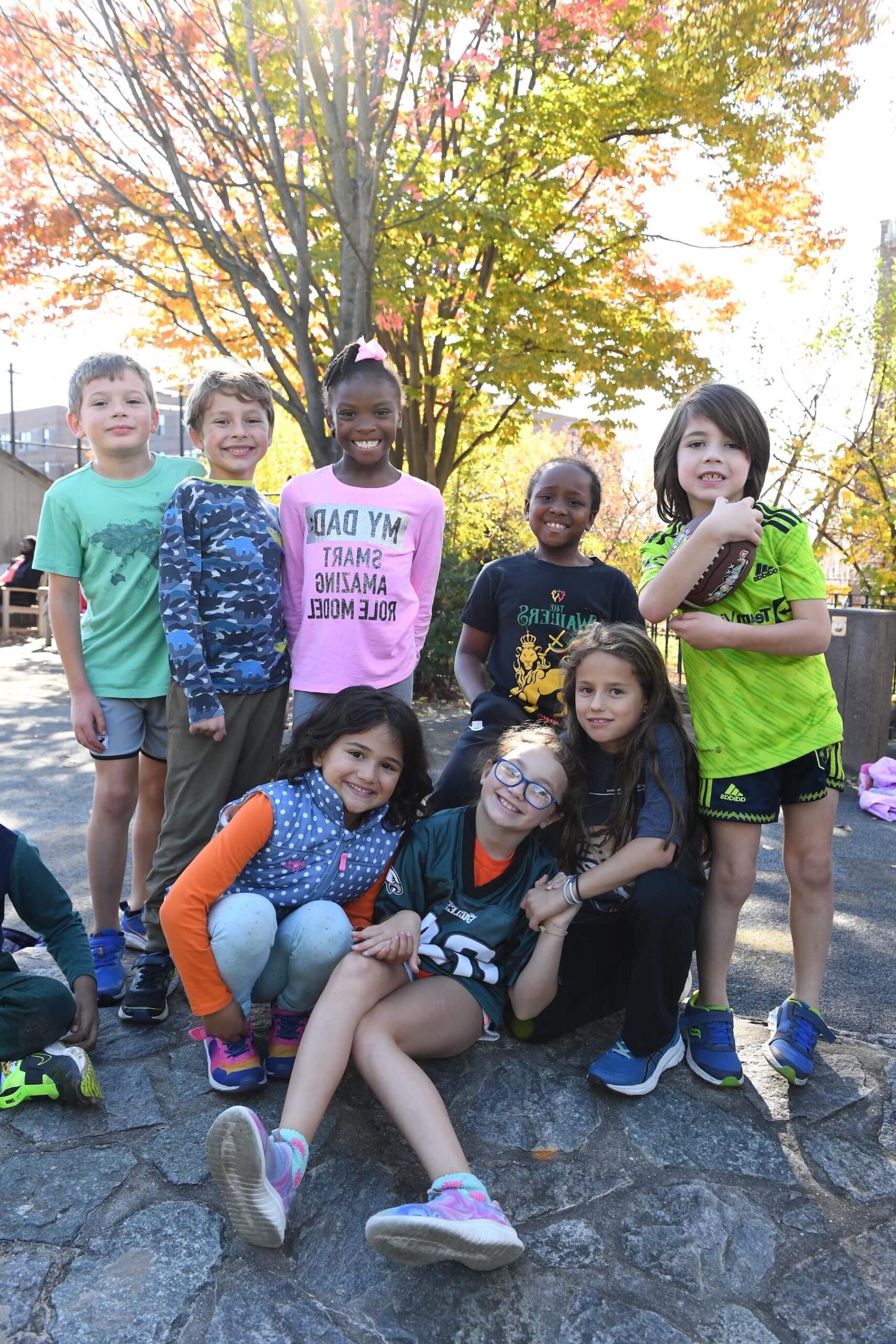Ethical Culture Fieldston School group of Fieldston Lower students smiling at the camera
