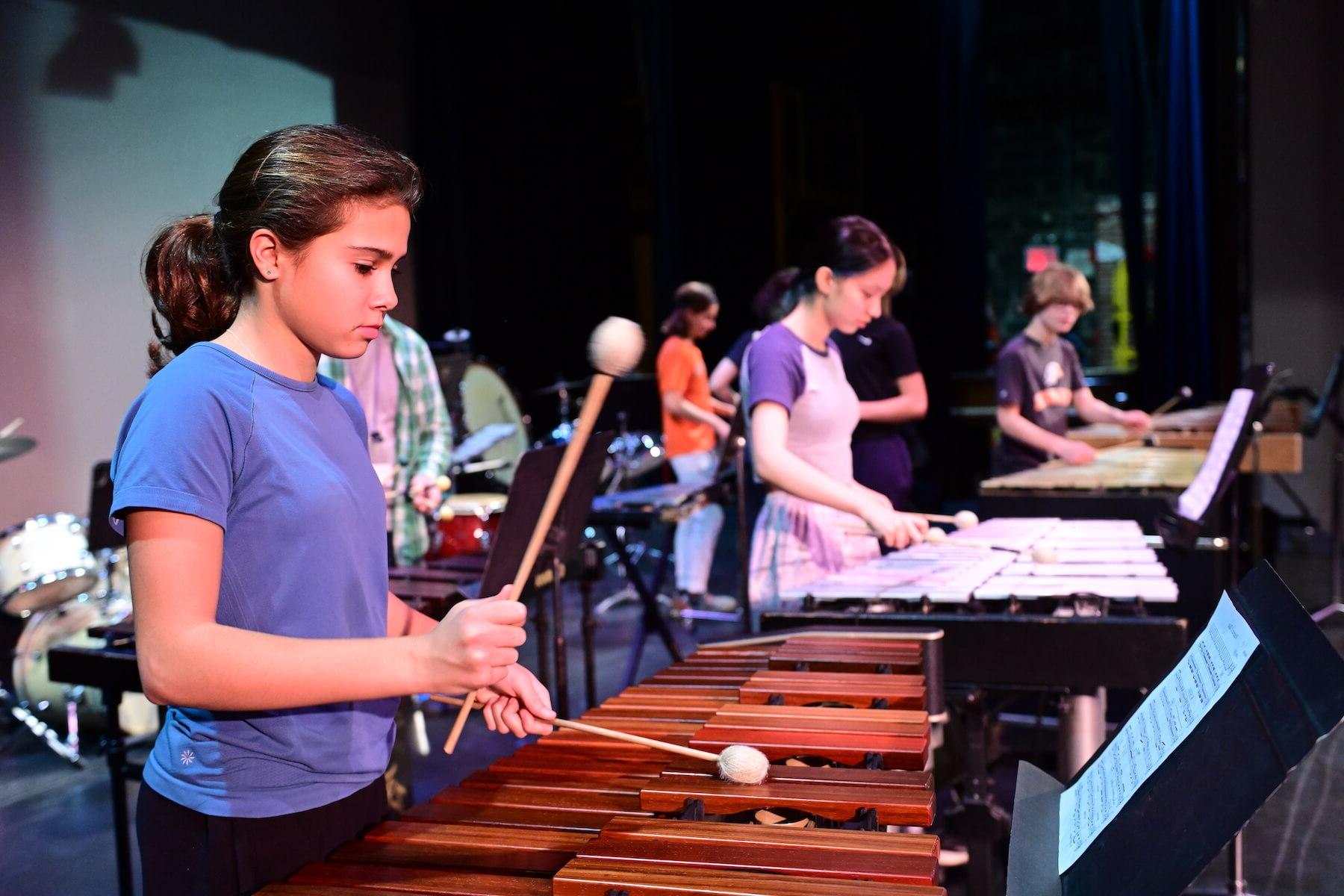 Ethical Culture Fieldston School students preparing to perform for Fieldston Middle percussion performance